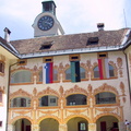 Idrija town castle courtyard with flags