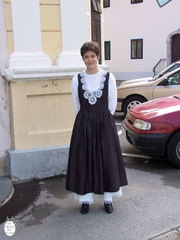Idrija welcoming ceremony girl in costume outside