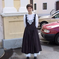 Idrija welcoming ceremony girl in costume outside